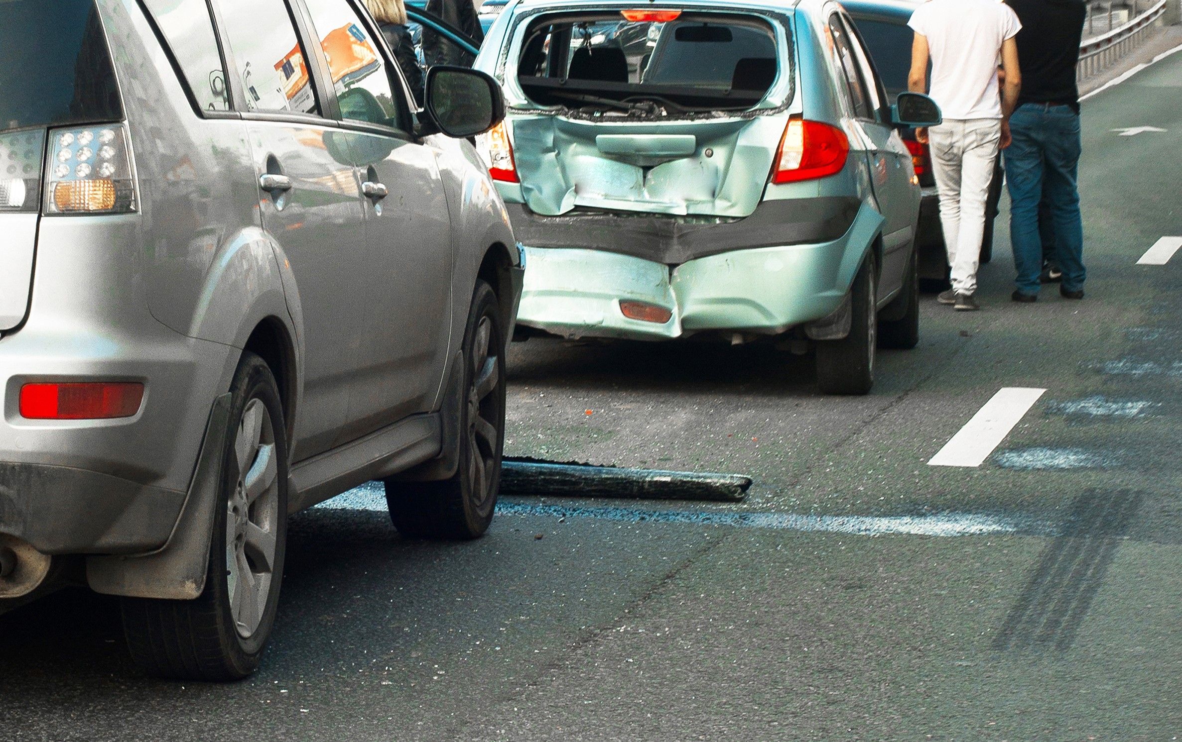 car parked in the middle of the road after being rear-ended